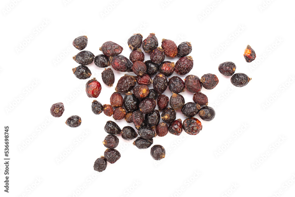 Heap of red dry rose hips isolated on a white background.