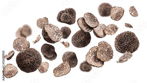 Summer truffles and truffle slices levitating or flying in the air on white background.