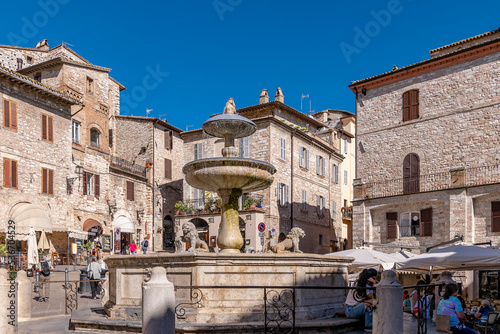 The ancient fountain of the three lions, Piazza del Comune square, Assisi, Perugia, Italy