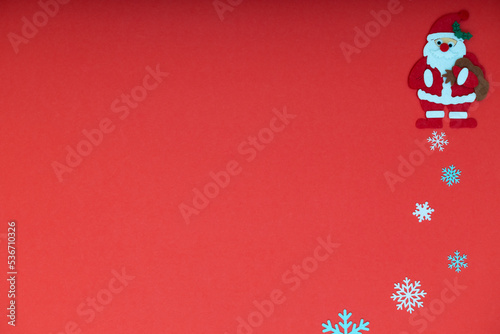 santa claus on red background with snowflakes