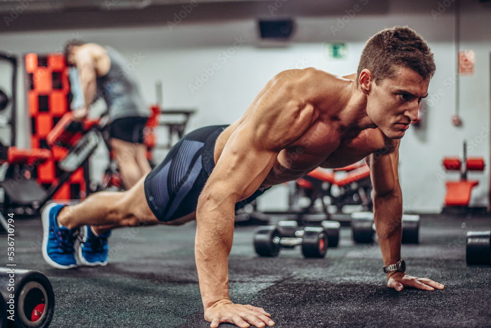 Fit man doing push-ups Fit man doing push-ups