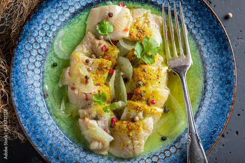 Canvas Print Tasty pickled fish with pepper and onion.
