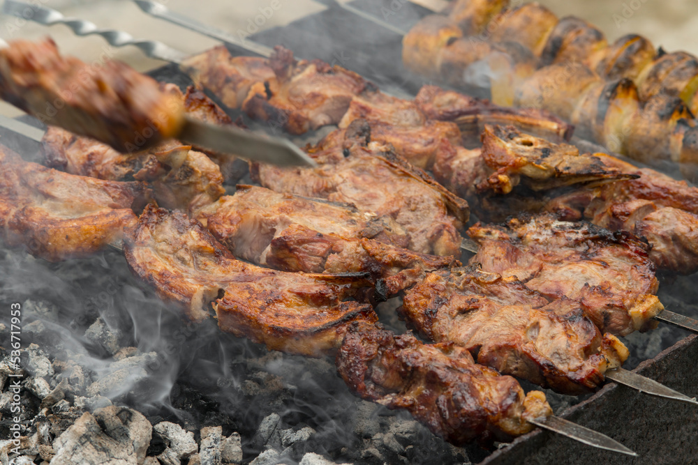 Cooking kebabs on skewers, closeup photo Cooking kebabs on skewers, closeup photo