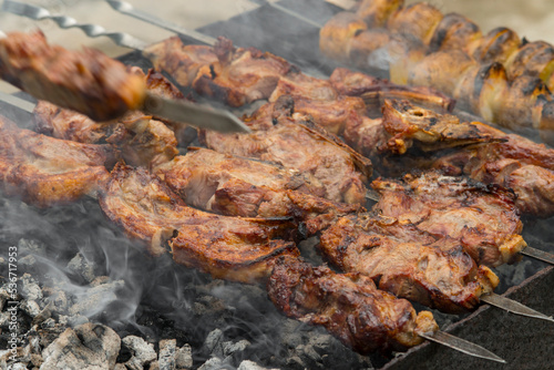 Cooking kebabs on skewers, closeup photo