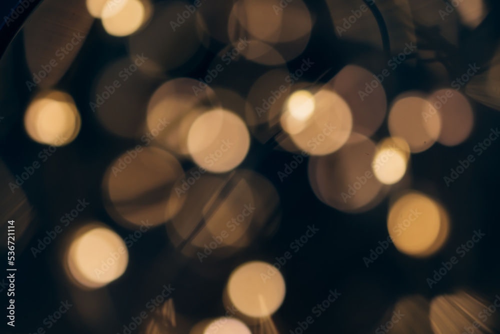 Orange Bokeh Background , Abstract holiday bokeh background. Blurred lights of garland hanging on Christmas tree. Focus on foreground. Copy space for your text and decorations. Orange Bokeh Background , Abstract holiday bokeh background. Blurred lights of garland hanging on Christmas tree. Focus on foreground. Copy space for your text and decorations.