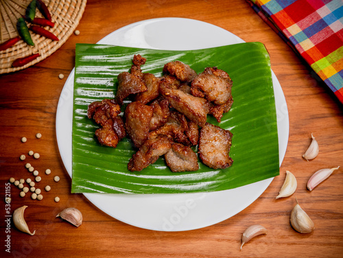 Fried pork with garlic and pepper on plate, Thai food	
