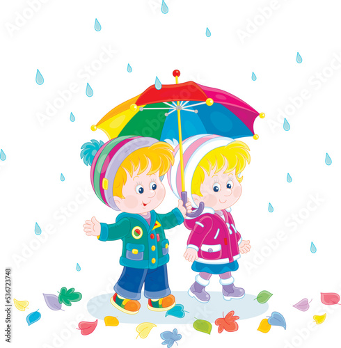 Little boy and girl hiding from the rain under their colorful umbrella while walking through fallen leaves on a rainy autumn day, vector cartoon illustration isolated on a white background