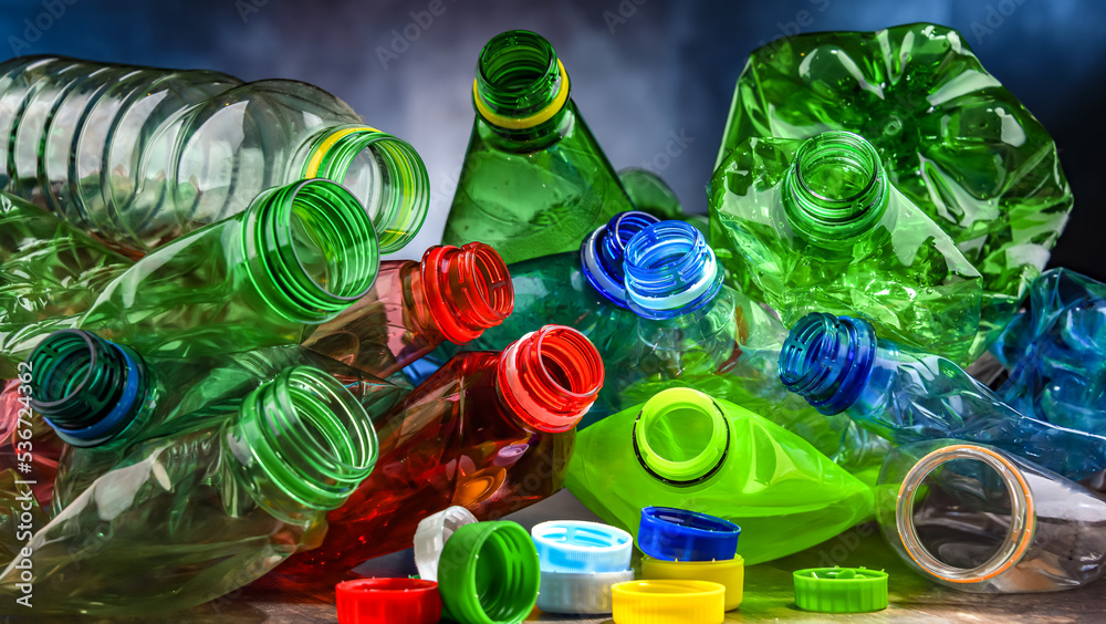 Empty colored drink bottles. Recyclable plastic waste - obrazy, fototapety, plakaty 