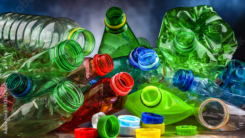 Empty colored drink bottles. Recyclable plastic waste photo