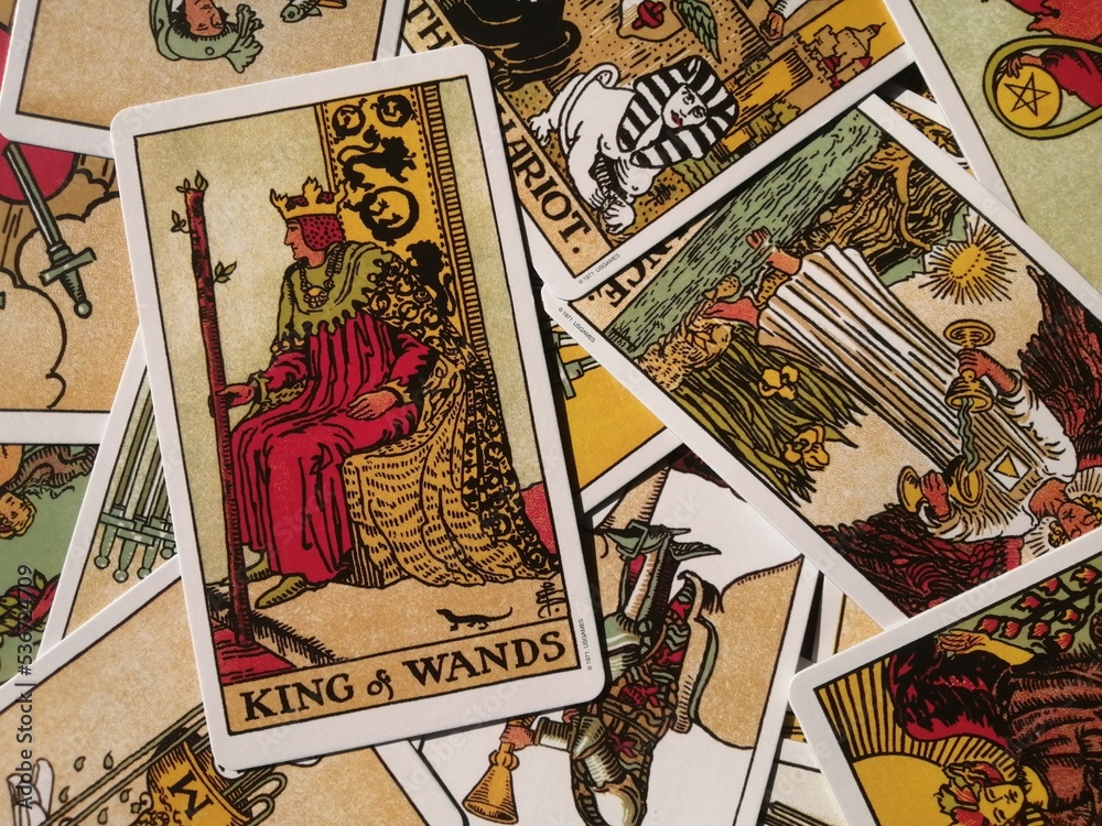 Picture of the King of Wands tarot card from the original Rider Waite tarot  deck with mixed tarot cards in the background Stock 写真 Adobe Stock