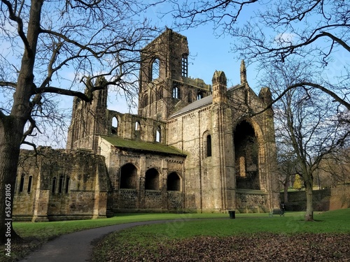 Ruins of Kirkstall Abbey under blue sky in Leeds, England