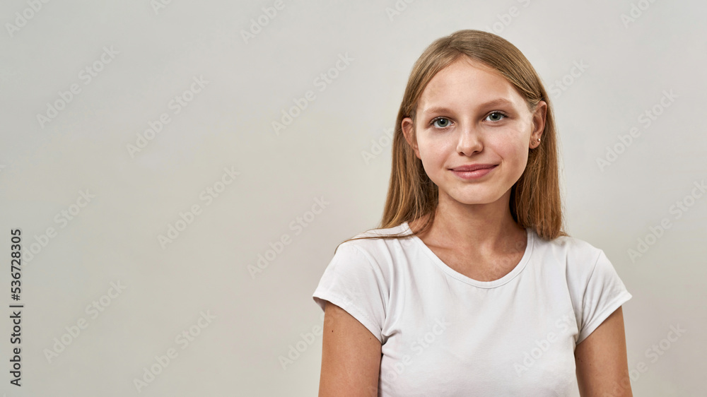 Cropped of smiling teenage girl looking at camera Cropped of smiling teenage girl looking at camera