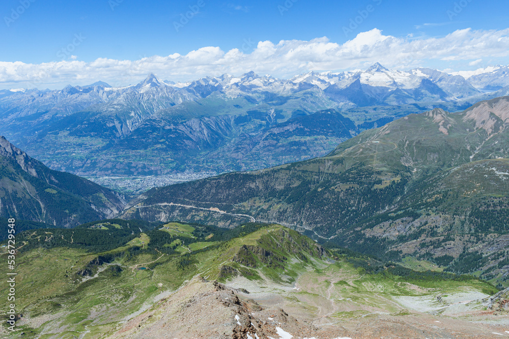 The mountains and the nature of the alps, during a summer day, seen from the simplon pass, Switzerland - July 2022.