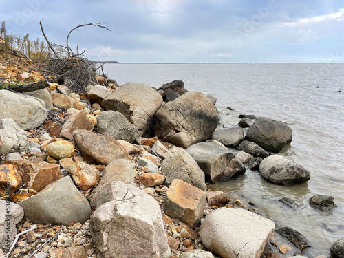 Stones of the shore of Lake Khanka in autumn. Russia, Primorsky Krai photo