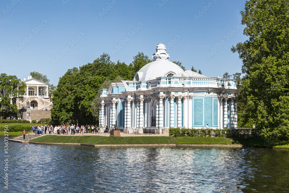 Tourists at the Grotto pavilion on the banks of the Big Pond in Tsarskoye Selo. Pushkin, St. Petersburg, Russia