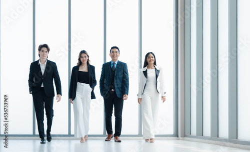 Group business people in formal wear walking standing discussion and proud on success in modern office