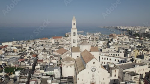 Drone flying towards Cathedral of Saint Sabinus in Bari downtown, Seascape in Background photo