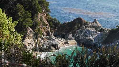 McWay Cove waterfall at the Big sur coast, in sunny California, USA - Handheld view