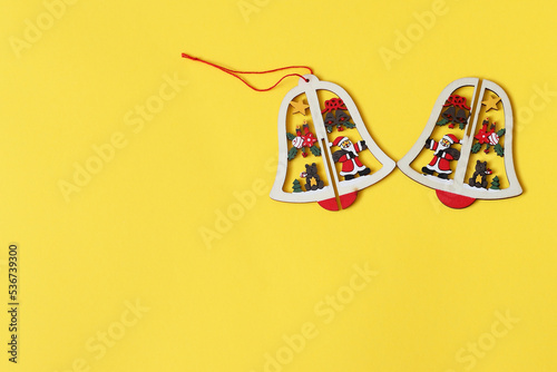 Christmas and New Year bell on yellow background