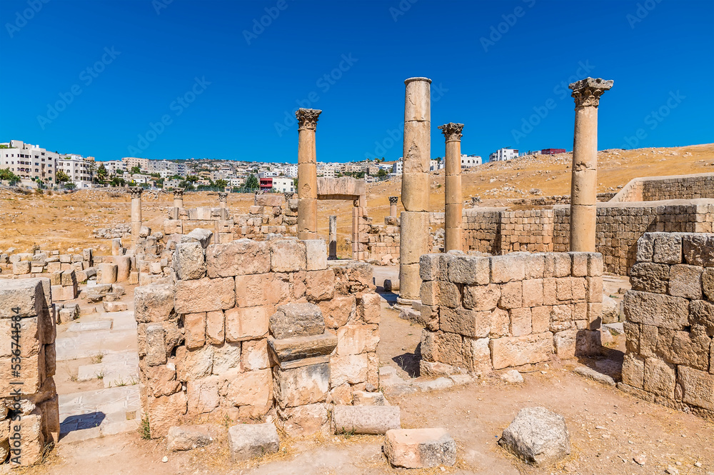 A view across the ruins of Saint George Church in the ancient Roman settlement of Gerasa in Jerash, Jordan in summertime