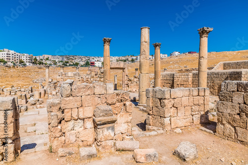 A view across the ruins of Saint George Church in the ancient Roman settlement of Gerasa in Jerash, Jordan in summertime