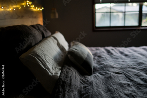 Window light on linen bedspread photo
