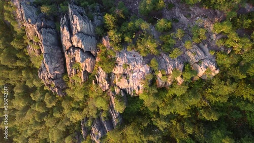Flying up above rocks of taganay national park mountains at sunrise photo