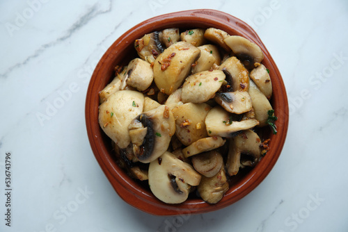 A bowl of sauteed mushrooms photo