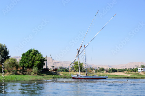 Obraz na płótnie Boats on the Nile River near the city of Luxor on a sunny summer day. Egypt w salonie