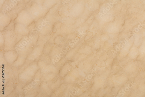 Crema Marfil Marble background, texture in beige color for stylish design. Slab photo. Glossy pattern for exterior home decoration, floor tiles, 3d ceramic, wall tiles. Pattern for exterior projects.