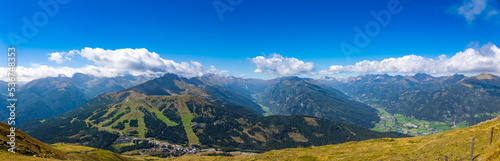 Large panoramic photo with view for the Austrian Alps between Carinthia and Salzburg Land. View from the summit above the cloud line into the valleys. 