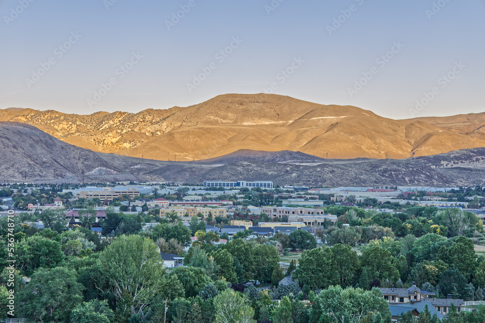 Mountain in Reno Illuminated in Yellow During Golden Hour