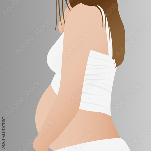 Beautiful pregnant woman, expectant mother hugging her belly with her hands