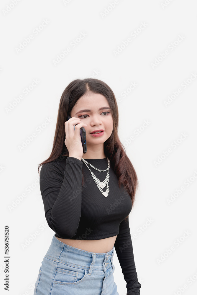 A chatty young woman calls her friend to tell her the news. Studio shot isolated on a white background. Studio shot isolated on a white background. A chatty young woman calls her friend to tell her the news. Studio shot isolated on a white background. Studio shot isolated on a white background.