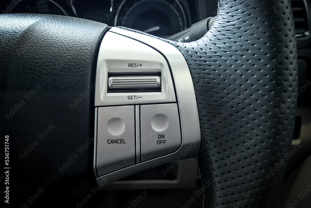 Obraz premium Cruise control button on car steering wheel