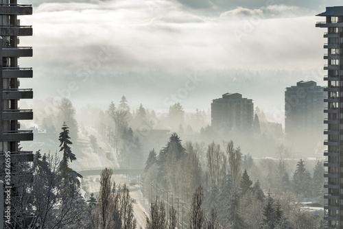 City on foggy winter morning in Canada photo