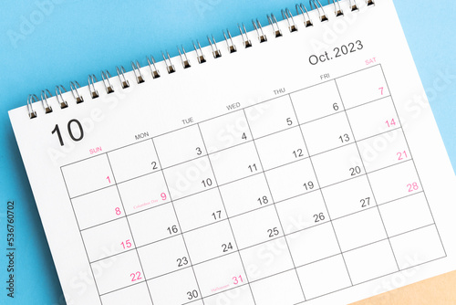 calendar October 2023 top view on a blue background