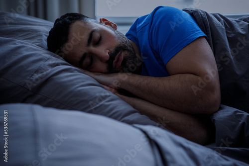 Sleep, insomnia and people, conceptually speechless man lying in bed at home at night © Home-stock