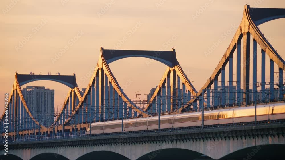 aerial view of steel bridge over qiantang river at twilight