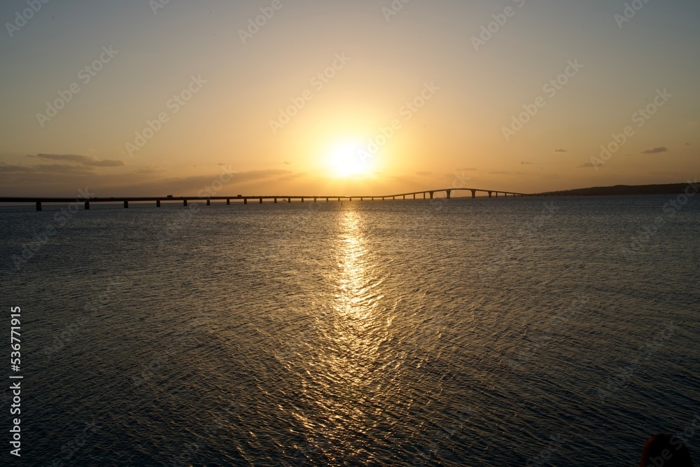 The sun setting behind the Irabu Bridge