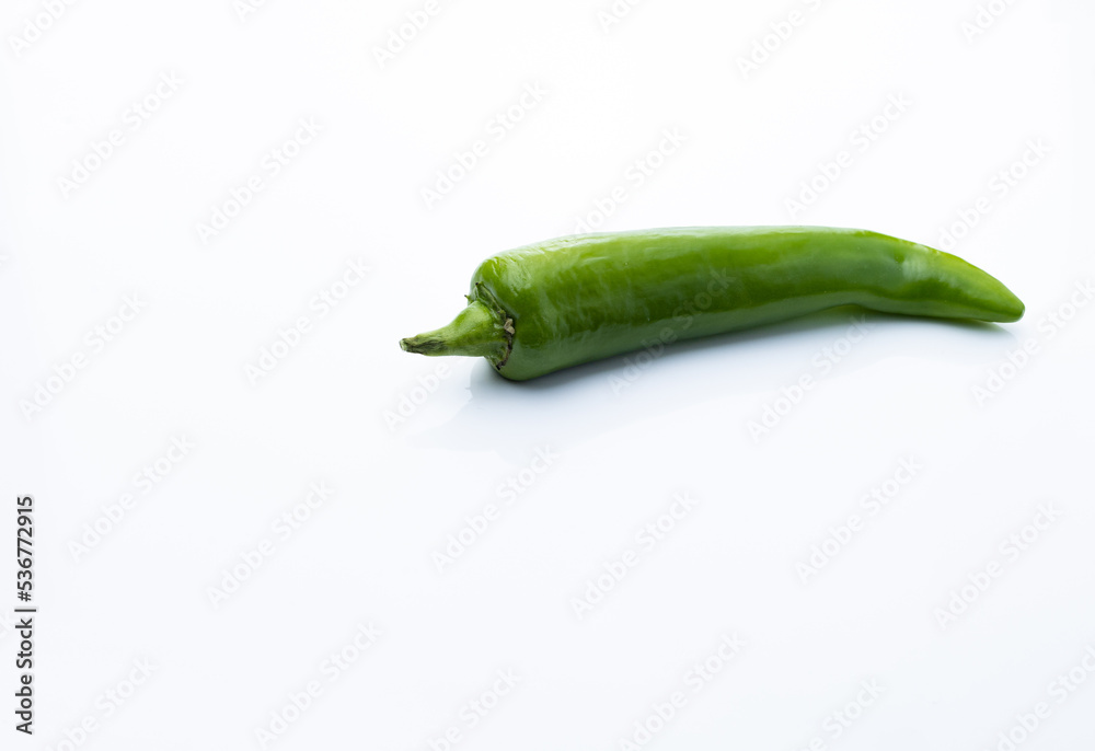 green chili isolated on white background. homemade vegetables green chili isolated on white background. homemade vegetables
