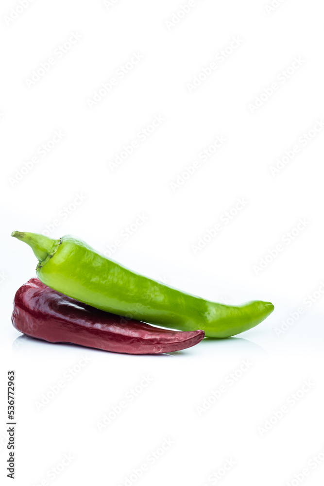 green and red chili isolated on white background. homemade vegetables green and red chili isolated on white background. homemade vegetables
