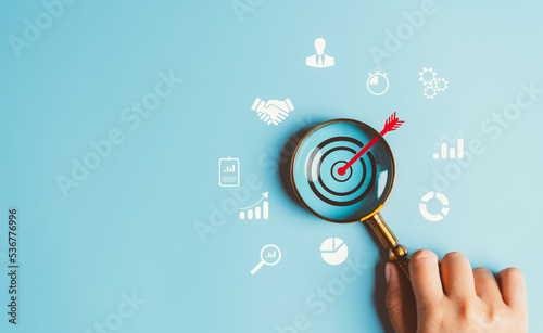 Magnifier glass focus to target  icon which for planning development leadership and customer target group concept.