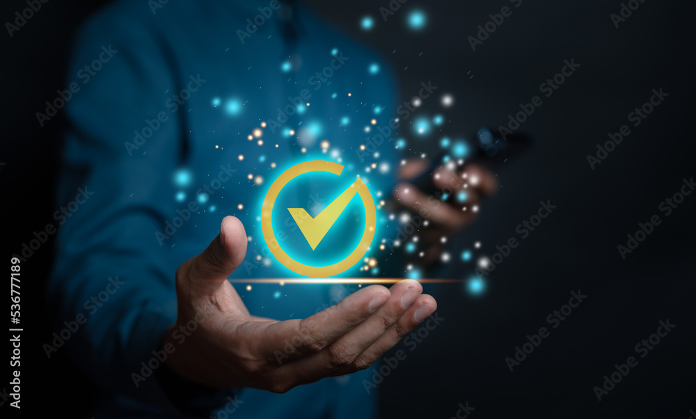 Businessman use mobile phone giving with tick correct mark to approve document and project business concept. Businessman use mobile phone giving with tick correct mark to approve document and project business concept.