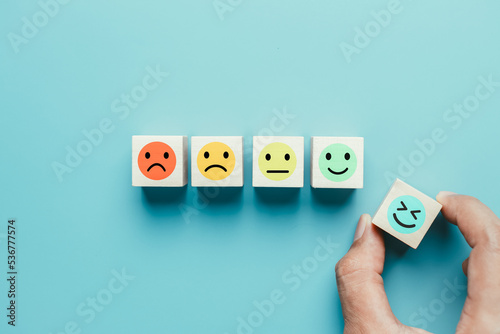 Smiley face mental health assessment positive. Thinking boost energy or fresh wellness emotion, Hand selection max happiness emotion. child wellness,world mental health day lifestyle of life concept.