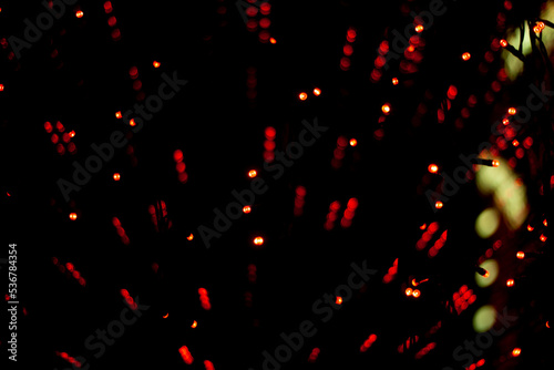 Red lights in dark. Heralds on glass. Interior details. Red dots texture.