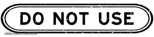 Grunge black do not use word rubber seal stamp on white background