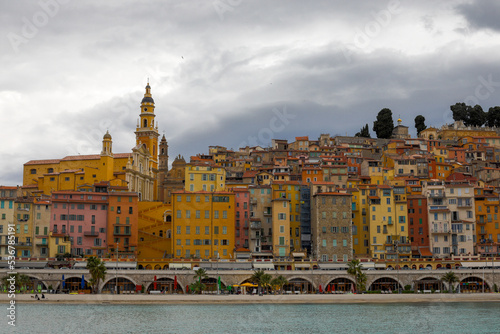 Old town and architecture of Menton on the French riviera during a cloudy spring day.