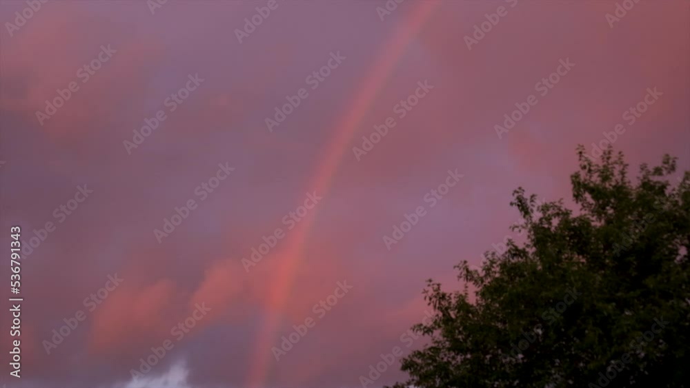 Rainbow in the red sky. Selective focus. Rainbow in the red sky. Selective focus.