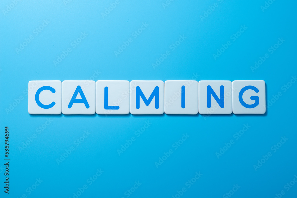 Word CALMING over a blue background,CALMING Concept Word CALMING over a blue background,CALMING Concept